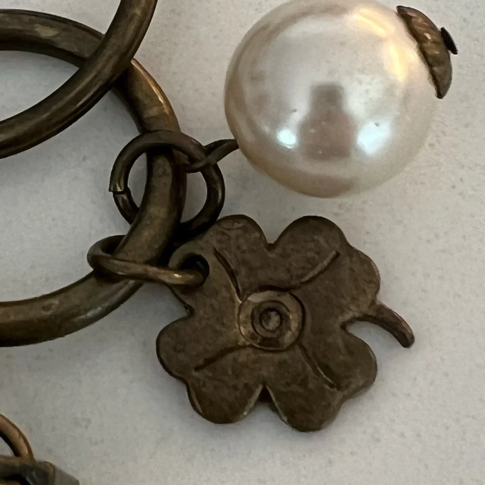 NWOT NINE WEST Brass tone keychain with 6 good luck charms​ pearl heart clover